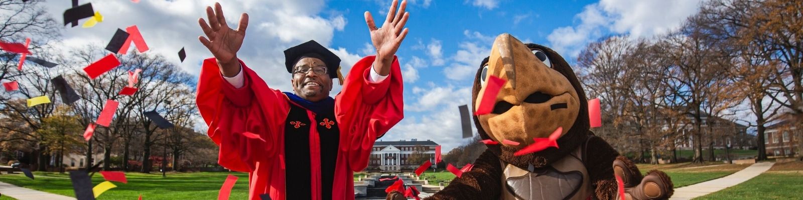 president pines and testudo throwing confetti