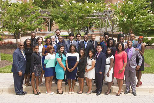 group of scholars pose